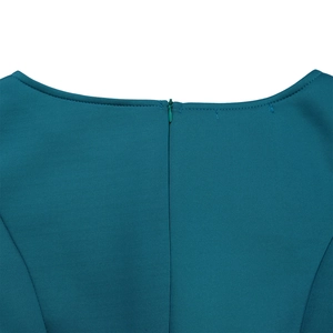 Detail of the back neckline featuring a peacock blue dress with seamless hidden zipper