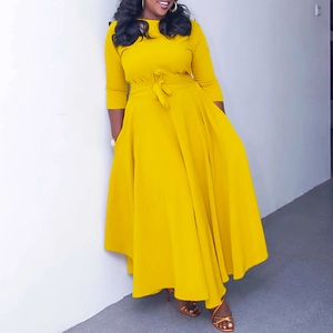 Elegant bright yellow long sleeve maxi dress with round neck and high waist tie belt