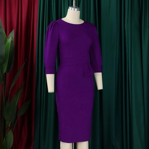 Close-up of purple pencil dress featuring puff sleeves and elegant waist ruffle detail