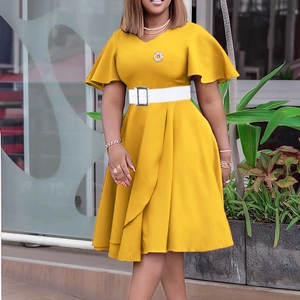 Detail of elegant yellow plus size dress with V-neck, bell sleeves and white waist belt