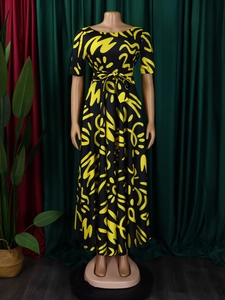 Short sleeve maxi dress with bold yellow and black African print and waist tie