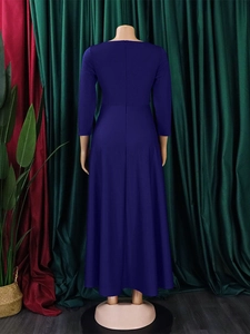 Elegant dark blue long sleeve A-line maxi dress with back zipper on a model