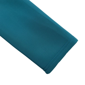 Detail of peacock blue evening dress showing high-density knit fabric and neat double-needle hem
