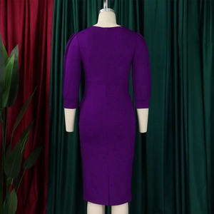 Detail view of the deep purple bodycon dress with invisible back zipper and stylish slit