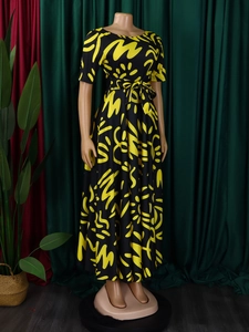 Short sleeve African print maxi dress in black and yellow with waist tie and flared hemline