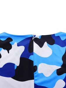 Detail shot of elegant floral print dress featuring a hidden zipper and crew neck design
