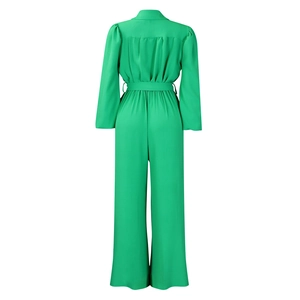 Rear view of bright green long sleeve jumpsuit with waist belt and pleated back detail