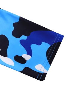 Detail of professional double-needle stitching on blue geometric camo printed sleeve