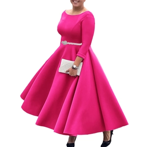 Detail of elegant rose red evening gown with sparkling rhinestone waist belt and A-line skirt