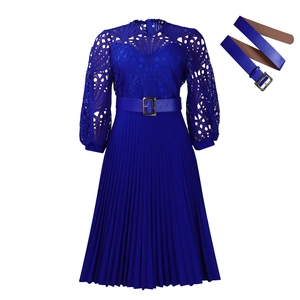 Detail of royal blue dress featuring intricate lace crochet hollow and pleated texture