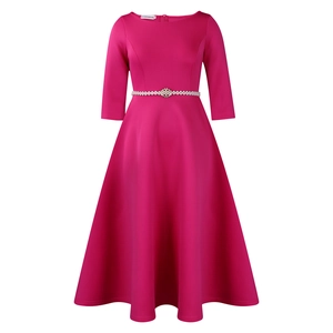 Detailed view of elegant rose red A-line dress with pearl belt and sparkling floral buckle