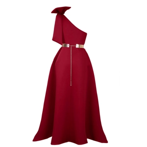 Detailed shoulder view of burgundy evening dress with large bow and golden metal chain belt