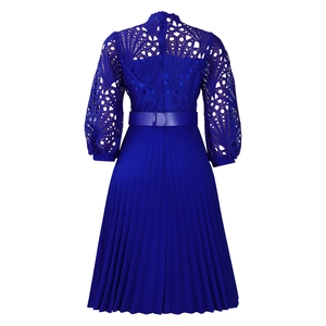 Detailed view of Klein blue lace crochet bodice with elegant accordion pleated skirt