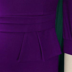 Detail of purple dress featuring elegant horizontal pleats and peplum waist structure