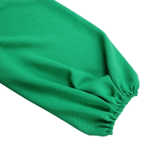 Detailed view of bright green long sleeve with elastic ruched cuff and textured fabric