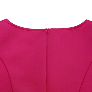 Detail of fuchsia evening dress back featuring an invisible zipper and refined stitching