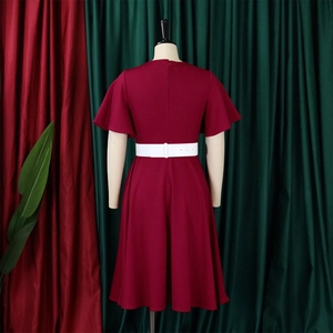 Detail of burgundy V-neck plus size dress back view with flare sleeves and white belt