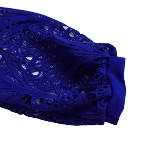 Close-up of deep blue hollow lace embroidery with intricate geometric circle patterns