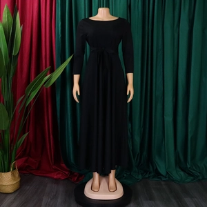 Close-up of elegant black long-sleeve maxi dress featuring adjustable drawstring waist detail
