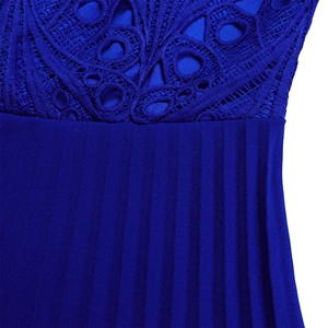 Close-up of royal blue lace embroidery and pleated fabric details on a dress