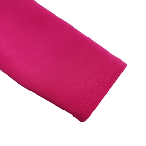 Detail of hot pink knitted dress cuff with precise double-needle stitching quality