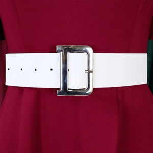 Detail of a wide white waist belt with a large silver D-shaped metal buckle on a dress