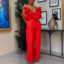 Close-up of elegant red jumpsuit featuring tiered ruffle V-neck and wide-leg trousers