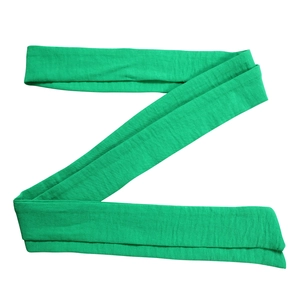 Detailed view of the bright green fabric belt with a textured crinkle cotton finish