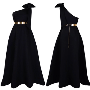 Detail of black one-shoulder evening gown with large bow and gold metal belt