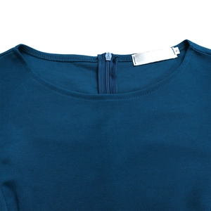 Close-up of the round neckline and concealed back zipper on a navy blue knit dress