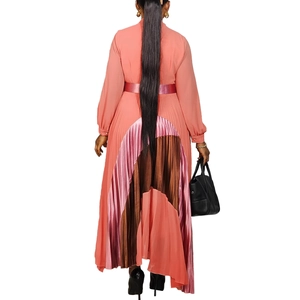Rear view of pleated maxi dress featuring a tri-color contrast hem and waist belt