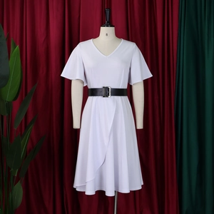 Detailed view of white V-neck dress with ruffle sleeves and black buckled waist belt