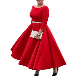Detail of red long-sleeve evening gown featuring a waist belt with sparkling silver rhinestones