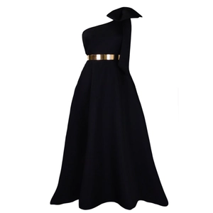 Detail of elegant black one-shoulder evening gown featuring a large bow and gold metal belt