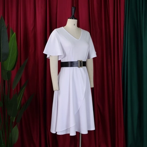 Detail of white V-neck plus size dress with black belt and gold buckle on a mannequin