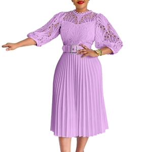 Detailed view of lavender lace hollow embroidery and pleated skirt with matching waist belt