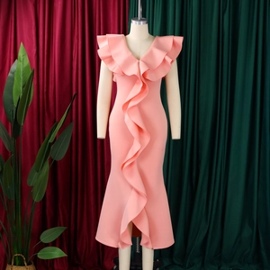 Detail of V-neck ruffled fishtail dress in pink elastic fabric on mannequin