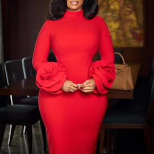 Detail of the 3D handmade rose floral decoration on the sleeve of a red bodycon dress