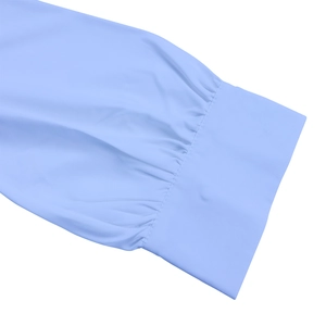 Macro detail of pleated cuff on light blue dress with fine stitching and smooth fabric