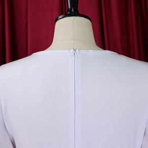 Detail of invisible back zipper and premium fabric texture on white V-neck dress