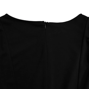 Close-up of the back neckline with a hidden zipper on an elegant black bubble sleeve dress