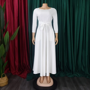 Front view of white long sleeve maxi dress featuring high waist tie and side pockets