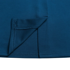 Detailed close-up showing reinforced slit stitching and hem quality of the blue dress