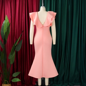 Detail of V-neck back design with layered ruffles on a pink fishtail evening dress