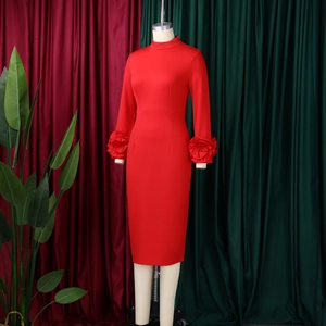 Detailed close-up showing the 3D floral pleated decorative cuffs of a red elegant dress