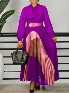 Elegant purple pleated maxi dress with contrasting pink hem and tie-neck design