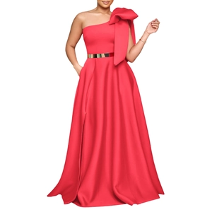 Detail view of red satin dress featuring a large shoulder bow and a wide gold metallic belt