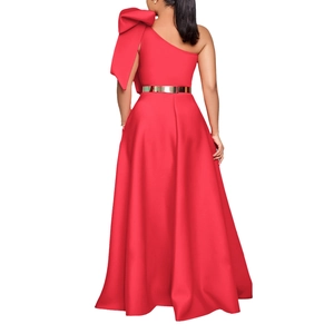 Detail of red one-shoulder evening gown with large bow and gold metal belt on the back