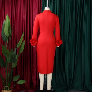 Detail of red bodycon dress featuring elegant 3D floral accents on sleeves and back zipper