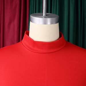 Close-up of red mock neck dress showing fine knit texture and neckline craftsmanship